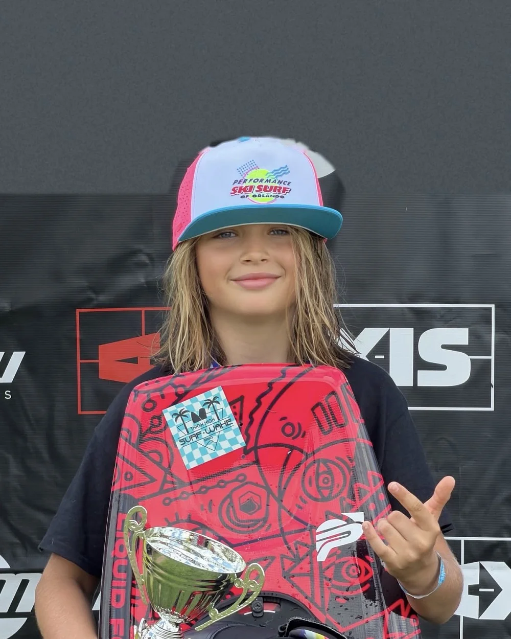 Blaze Poss on the podium with his trophy and board after winning Stop 2 of the 2026 Gravel Tour