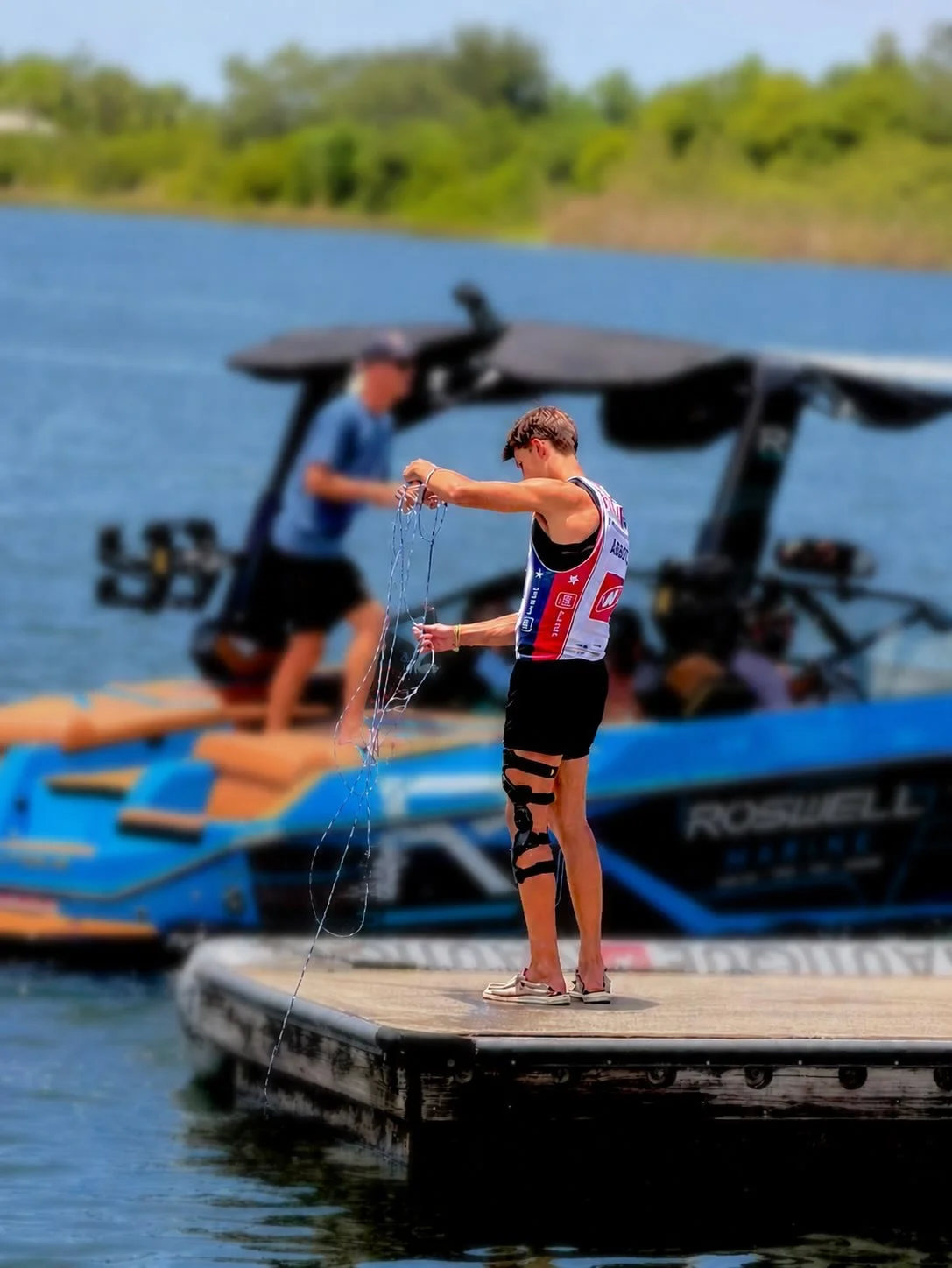 Rex Abbott on the dock in his competition jersey, 2026