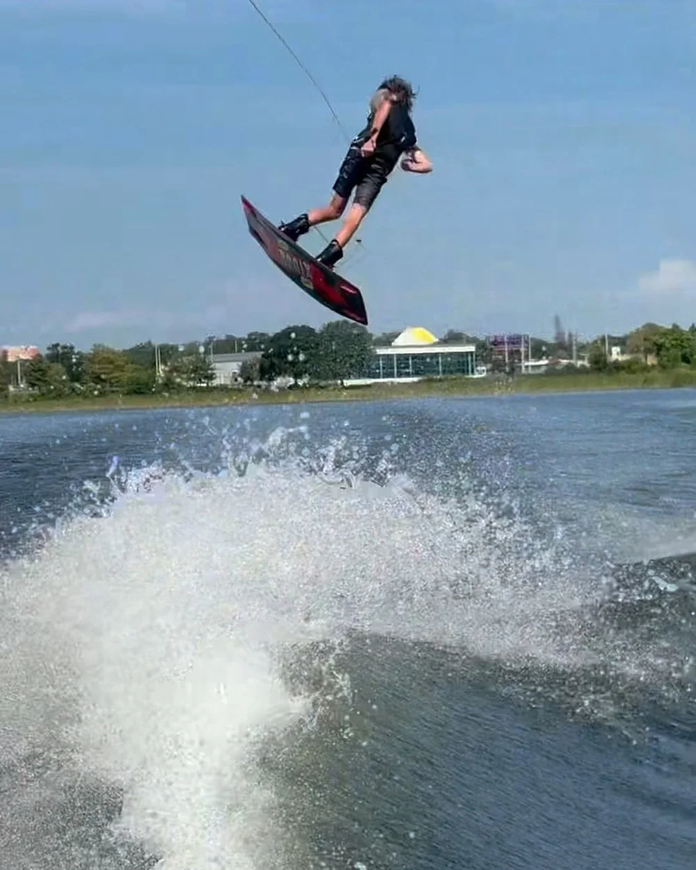 Tucker Balmert in the air above the wake