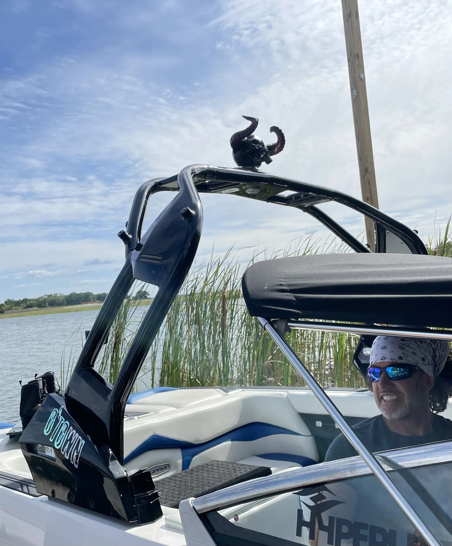 Glen at the wheel under the tower, Lake Barton