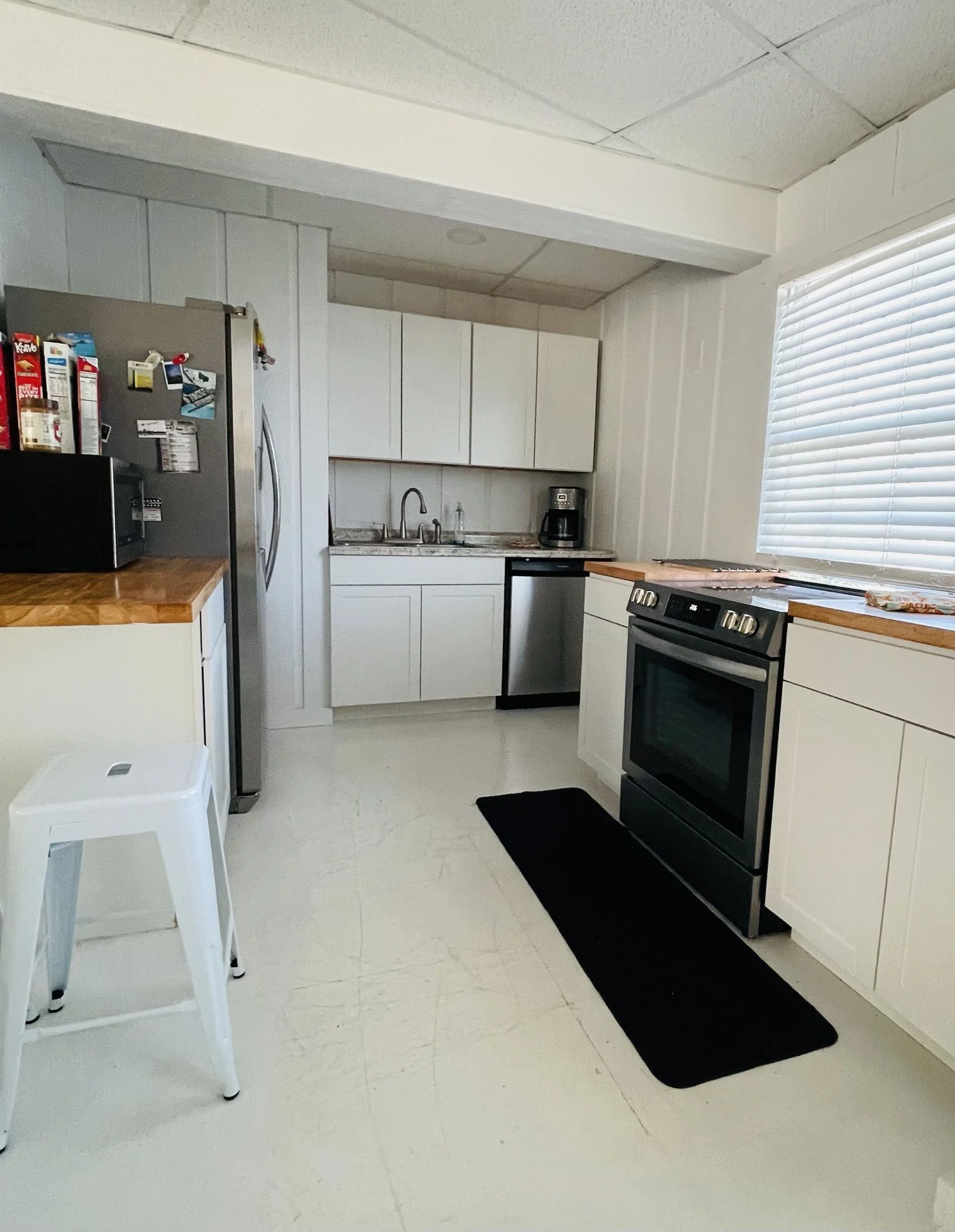 The kitchen at O’Town with fridge, oven and counters