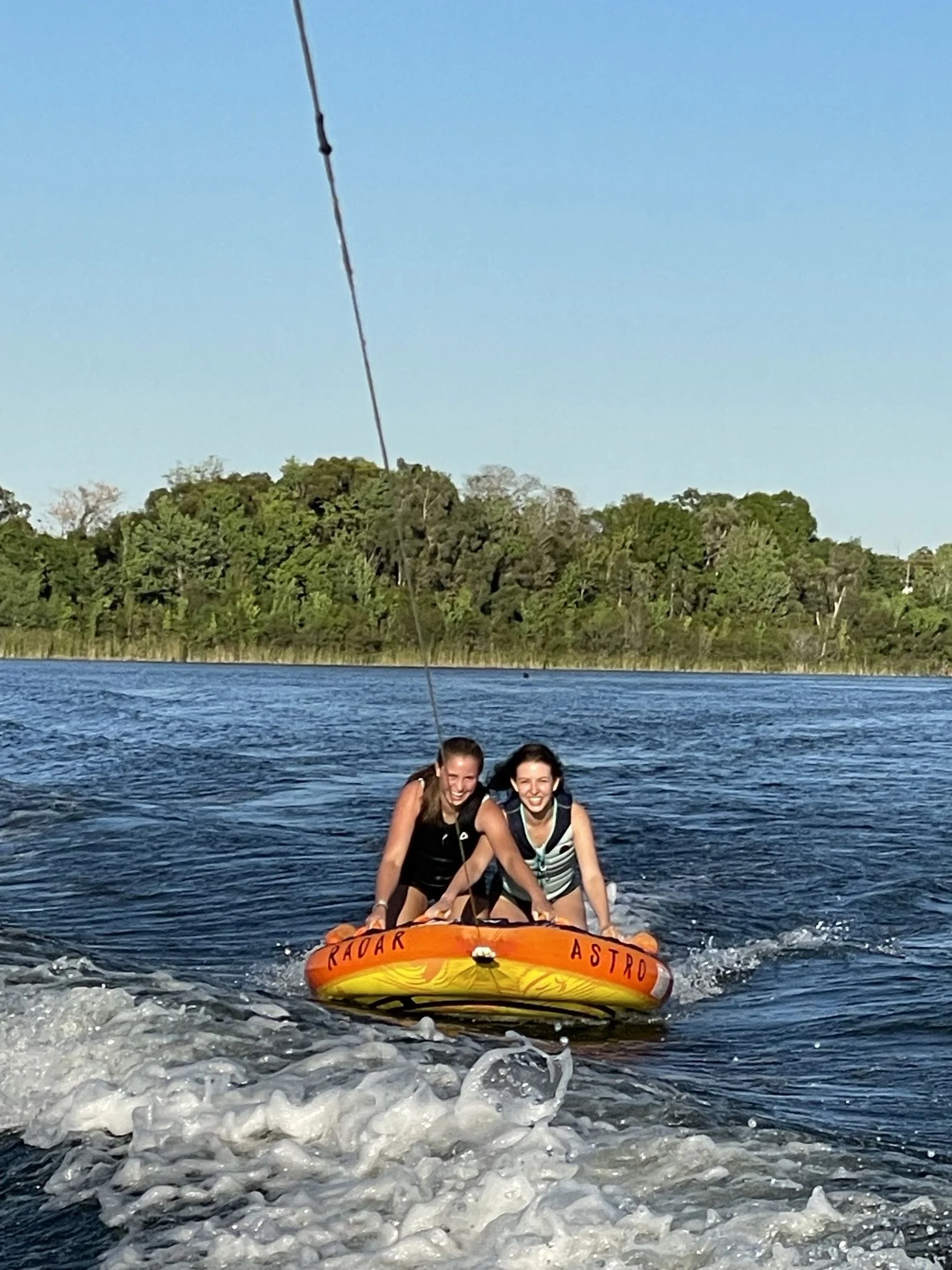 Friends tubing on Lake Barton